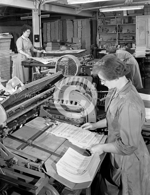 A folding machine in a printworks, Mexborough, South Yorkshire, 1959. Creator: Michael Walters.