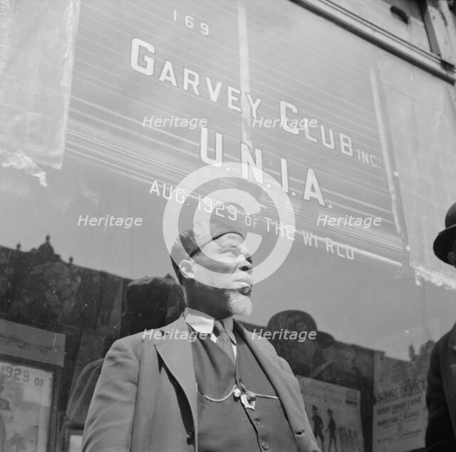 A follower of the late Marcus Garvey who started the "Back to Africa" movement, New York, 1943. Creator: Gordon Parks.