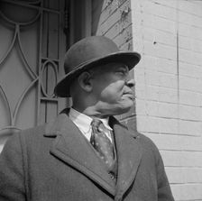 A follower of the late Marcus Garvey who started the "Back to Africa" movement, New York, 1943. Creator: Gordon Parks