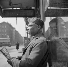 A follower of the late Marcus Garvey who started the "Back to Africa" movement, New York, 1943. Creator: Gordon Parks