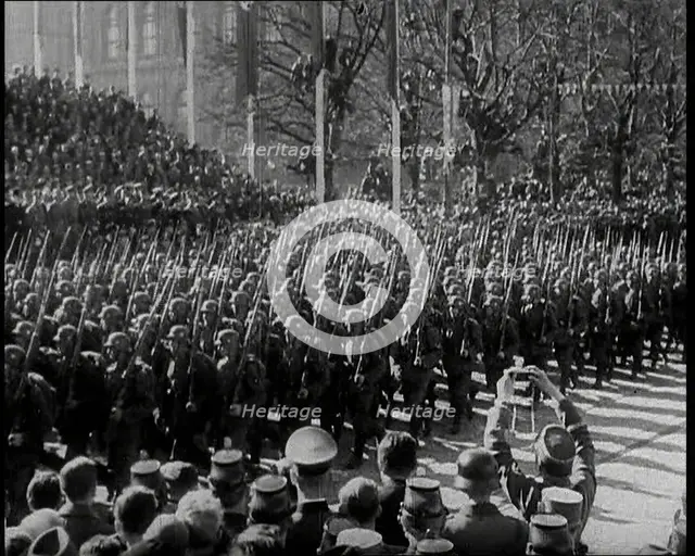 A Formation of Male German Soldiers Marching Past a Raked Platform of Officials on a Vienna..., 1938 Creator: British Pathe Ltd.