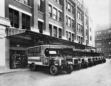 A fleet of Lyons delivery vans, Cadby Hall, West Kensington, London. Creator: Unknown