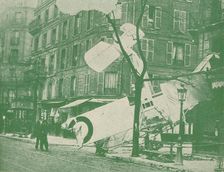 A French aeroplane descends in a Paris street, c1917 (1919)