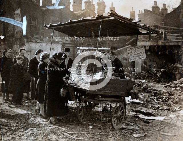 A fruit stall in a bomb wrecked clearing, London, World War II, c1940-c1945. Creator: Unknown.