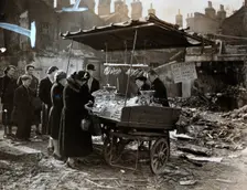 A fruit stall in a bomb wrecked clearing, London, World War II, c1940-c1945. Creator: Unknown