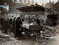 A fruit stall in a bomb wrecked clearing, London, World War II, c1940-c1945. Creator: Unknown