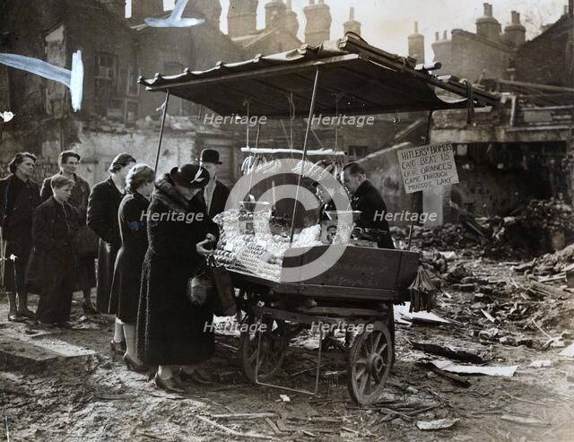 A fruit stall in a bomb wrecked clearing, London, World War II, c1940-c1945. Artist: Unknown