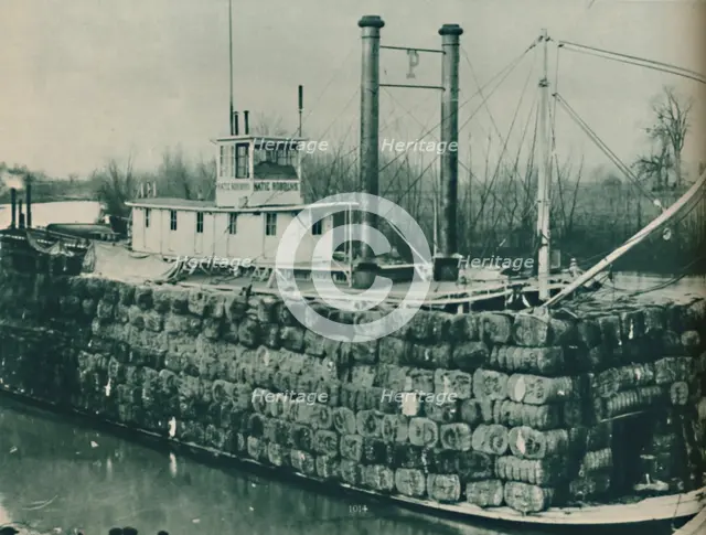 'A full load of Cotton often mounts high over the decks of the Mississippi steamboats', 1937. Artist: Unknown.