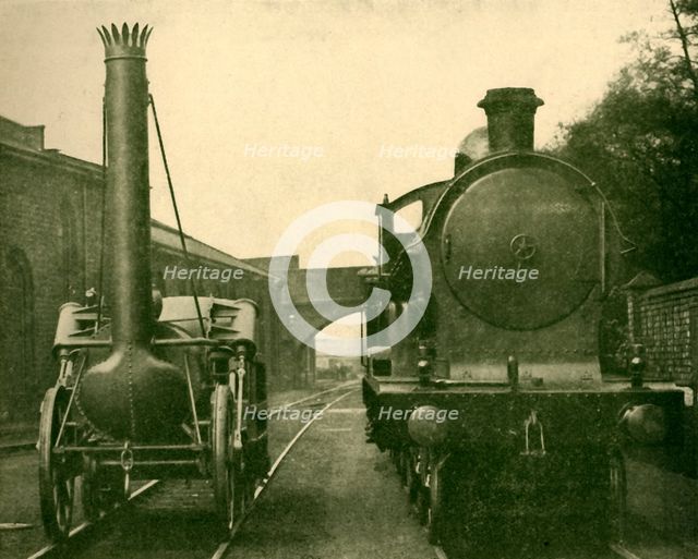 'A full size model of Stephenson's Rocket alongside an engine of the "George the Fifth" class, Londo Creator: Unknown.