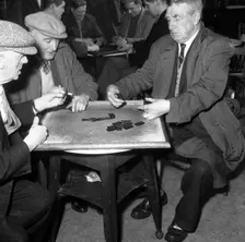 A game of dominoes in a miners welfare club, Horden, County Durham, 1963. Creator: Michael Walters