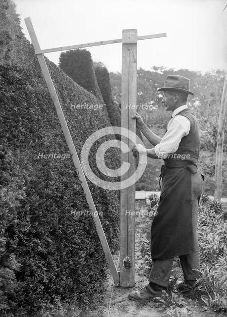 A gardener in the grounds of Great Dixter, East Sussex, c1919-c1933. Artist: Nathaniel Lloyd