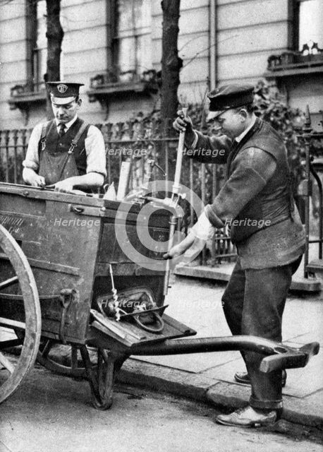 A gas fitter, London, 1926-1927.Artist: McLeish