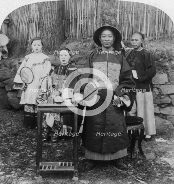 'A genial official of interior China, naval mandarin, Kinkow' (Jingzhou), China, 1900. Artist: Underwood & Underwood