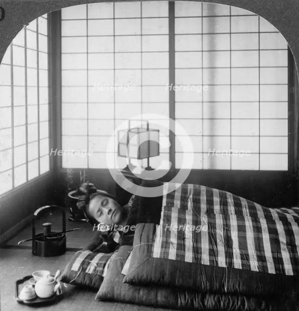 A geisha sleeping in a tea house, Hikone, Japan, 1904.Artist: Underwood & Underwood