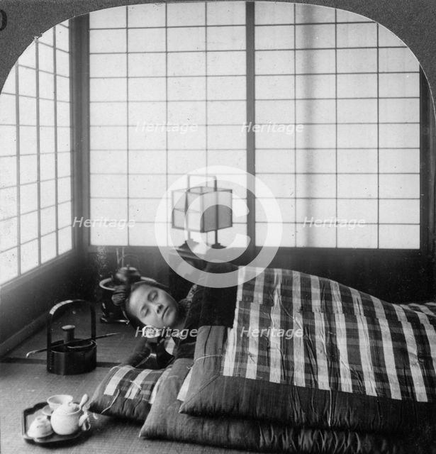 A geisha sleeping in a tea house, Hikone, Japan, 1904.Artist: Underwood & Underwood