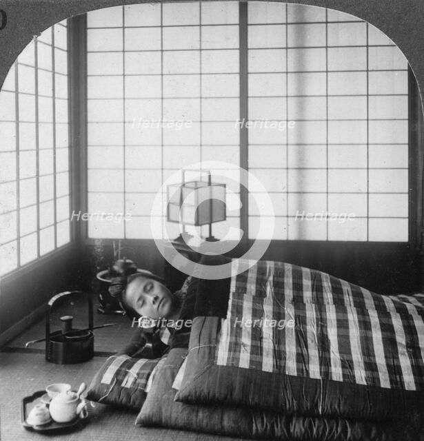 A geisha sleeping in a tea house, Hikone, Japan, 1904.Artist: Underwood & Underwood