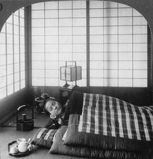 A geisha sleeping in a tea house, Hikone, Japan, 1904.Artist: Underwood & Underwood