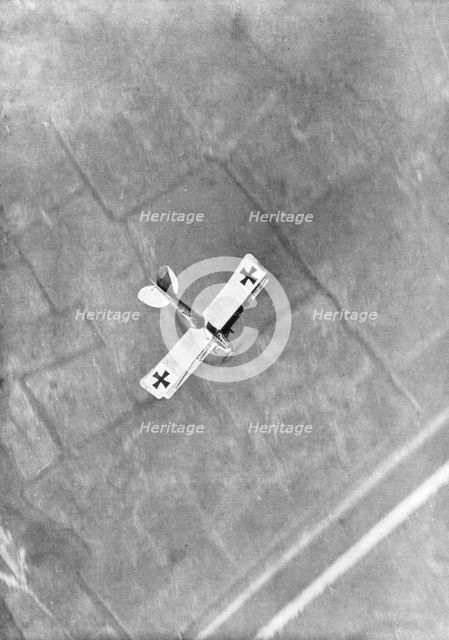 A German Aviatik aircraft photographed in flight by a Belgian aviator, Ypres, Belgium, 1916. Artist: Unknown