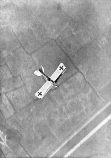 A German Aviatik aircraft photographed in flight by a Belgian aviator, Ypres, Belgium, 1916