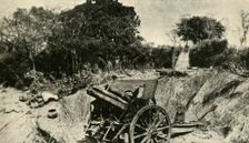 A German Gun Position in the Heart of the Jungle: one of the 4.1 howitzers captured in East Africa Creator: Unknown