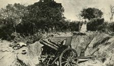 A German Gun Position in the Heart of the Jungle: one of the 4.1 howitzers captured in East Africa Creator: Unknown