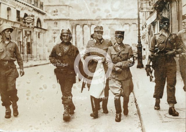 A German officer escorted by French soldiers, the liberation of Paris, World War II, 1944. Creator: Unknown.
