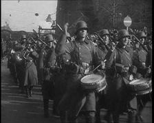 A German Military Band Marching Through the Rhineland, 1936. Creator: British Pathe Ltd