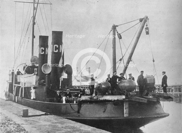 'A German mine layer leaving port with her mines ready on deck', 1914. Artist: Unknown.