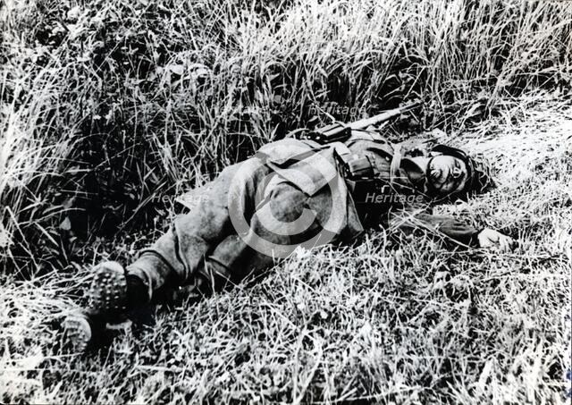 A German soldier killed during the invasion of Normandy, 1944. Artist: Unknown