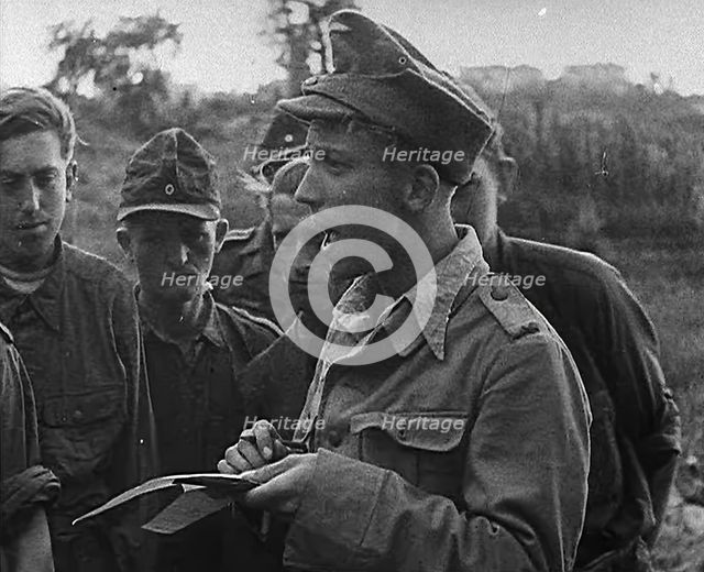 A German Prisoner of War Writing Details Down, 1943-1944. Creator: British Pathe Ltd.