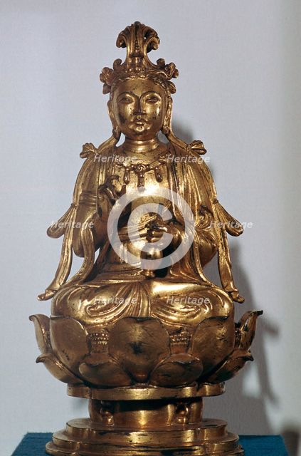 A gilt-bronze statuette of a Bodhisattva on a lotus leaf, 10th century. Artist: Unknown