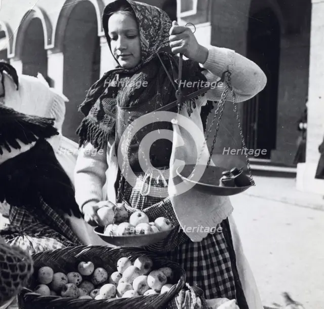 A girl selling apples, Zagreb, Croatia, Yugoslavia, 1939.  Creator: Unknown.