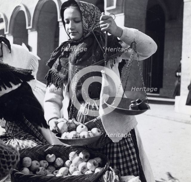 A girl selling apples, Zagreb, Croatia, Yugoslavia, 1939.  Creator: Unknown.