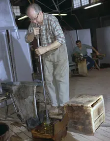 A glass blower at Strombergshyttan's glassworks, Sweden, 1950s. Creator: Unknown