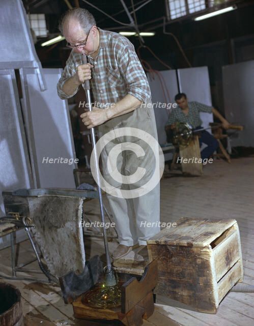 A glass blower at Strombergshyttan's glassworks, Sweden, 1950s.
 Creator: Unknown.