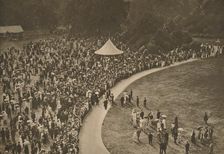 A Glimpse of One of the Annual Royal Garden Parties Among The Timbered Lawns of Buckingham Palace Creator: Unknown