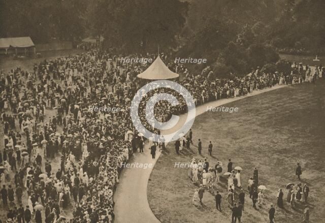 'A Glimpse of One of the Annual Royal Garden Parties Among The Timbered Lawns of Buckingham Palace', Creator: Unknown.