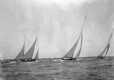 A group of 12 Metres sailing yachts racing on windward leg in good wind, 1933. Creator: Kirk & Sons of Cowes