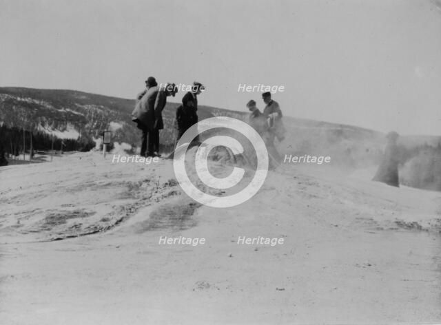 A group of tourists explore a geyser in the Upper Geyser Basin in Yellowstone National Park, 1903. Creator: Frances Benjamin Johnston.