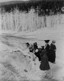 A group of tourists explore land formations in Yellowstone National Park, 1903. Creator: Frances Benjamin Johnston