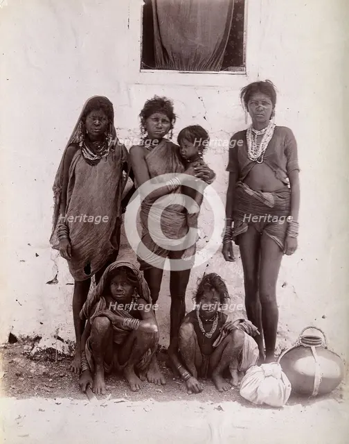 A group of women and children wearing decorated rings in their noses: Bombay at the..., 1896/1897. Creator: Unknown.