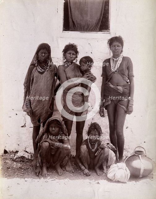 A group of women and children wearing decorated rings in their noses: Bombay at the..., 1896/1897. Creator: Unknown.