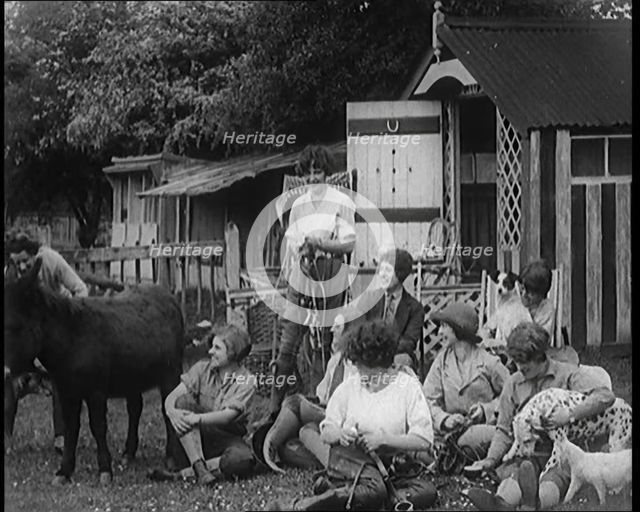 A Group of Young Female Civilians Sitting Outdoors with Various Animals Around Them, 1920. Creator: British Pathe Ltd.