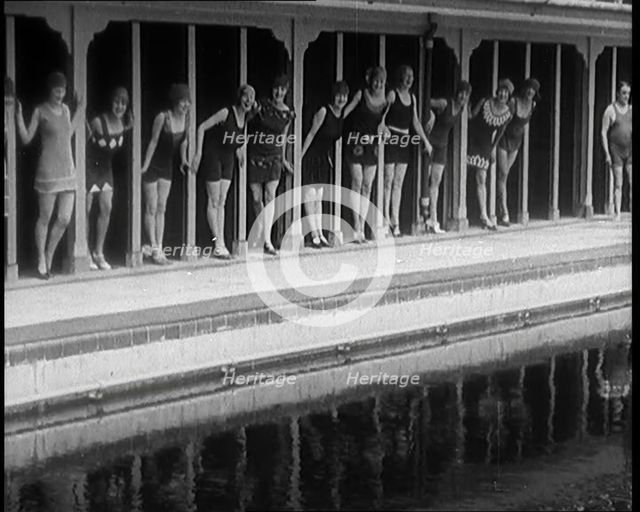 A Group of Young Female Civilians Wearing Short Swimsuits and Heeled Shoes Emerging from..., 1920. Creator: British Pathe Ltd.