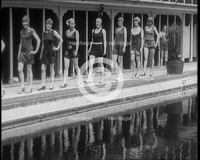 A Group of Young Female Civilians Wearing Short Swimsuits and Heeled Shoes Emerging from..., 1920. Creator: British Pathe Ltd.