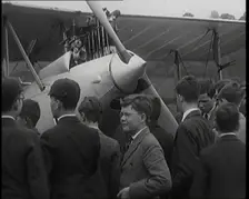 A Group of Young Male British Civilians Admiring an Airplane On an Airfield, 1920s. Creator: British Pathe Ltd