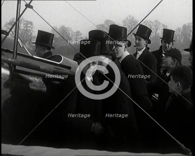 A Group of Young Male British Civilians Admiring an Airplane On an Airfield, 1920s. Creator: British Pathe Ltd.