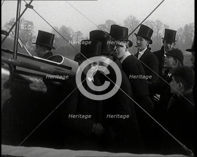 A Group of Young Male British Civilians Admiring an Airplane On an Airfield, 1920s. Creator: British Pathe Ltd.