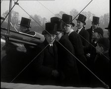 A Group of Young Male British Civilians Admiring an Airplane On an Airfield, 1920s. Creator: British Pathe Ltd