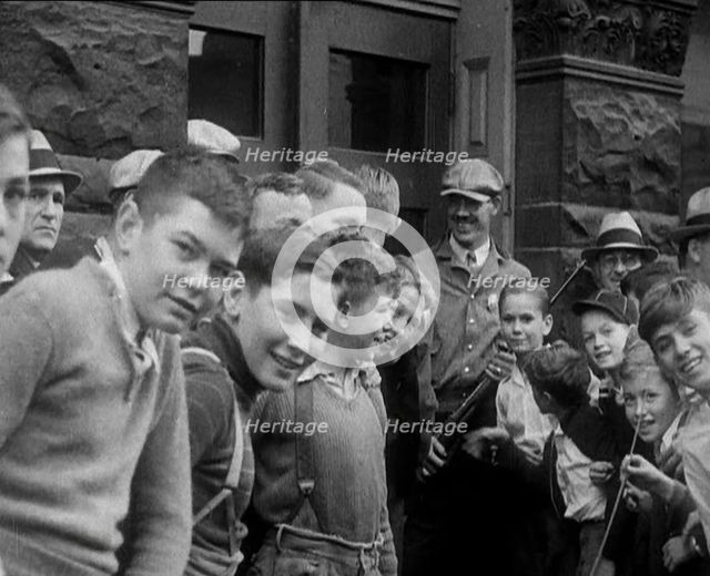 A Group of American Children Civilians Gathering Outside an Official Building with a Male..., 1930. Creator: British Pathe Ltd.